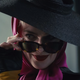 Harley Quinn committing the most terrible of crimes.